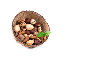 different nuts in a coconut peel on a white background