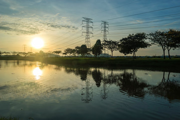 Reflextion of sunrise and electrical tower