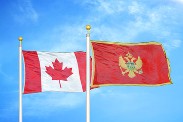 Canada and Montenegro two flags on flagpoles and blue cloudy sky