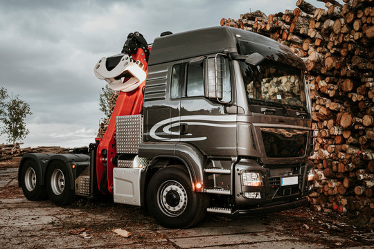 A truck transporting wood from the forest, wood storage