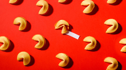 Fortune cookies on a red background, close-up.