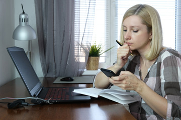 European caucasian business woman freelancer working remotely during quarantine of virus infection,...