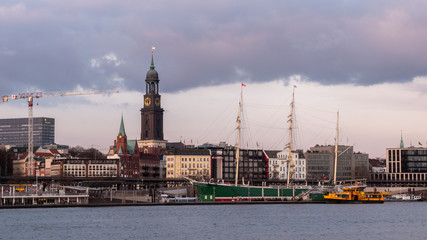 Hamburg, Germany, March 28, 2019: A panoramic view of the Elbe promenade in Hamburg with St....