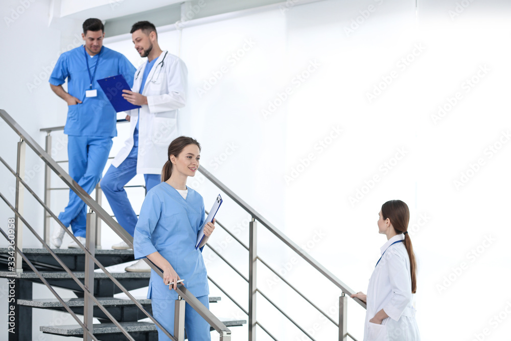 Canvas Prints Team of professional doctors on staircase in clinic