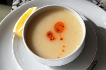 Turkish traditional lentil mashed soup on white ceramic bowl
