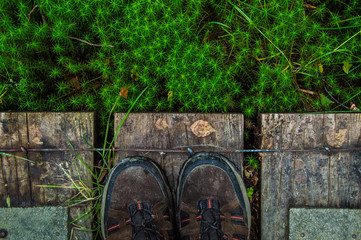 Hiking boots on wooden planks