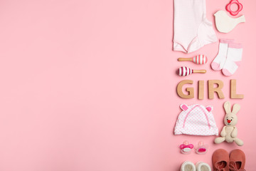 Flat lay composition with child's clothes and word Girl on pink background, space for text