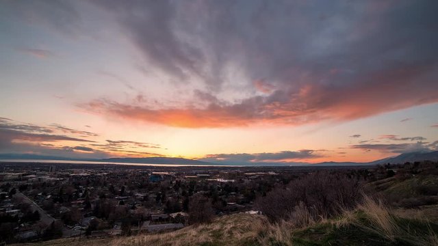 Sunset over Provo city in time lapse during sunset overlooking Utah Valley.
