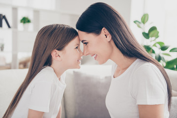 Profile side photo of charming idyllic cute mom daughter relationship touch forehead each other...