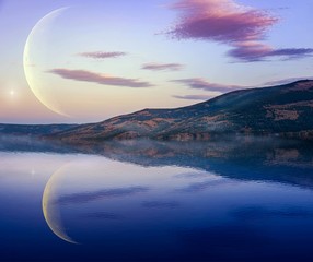 Landscape with mountains reflected in water . The romantic moon over water .