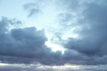 Lovely white fluffy clouds on a background of blue sky.