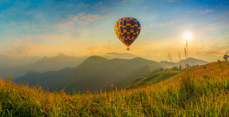 Hot air balloon flying over Phu Tab Berk hill in morning 