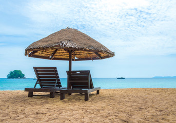 Gazebo and wooden lounge at seashore