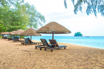 Gazebo and wooden lounge at seashore