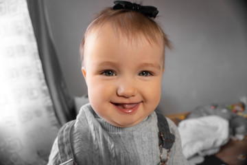 Cutie little baby girl smiles at home