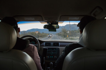 driving in a car towards mountains