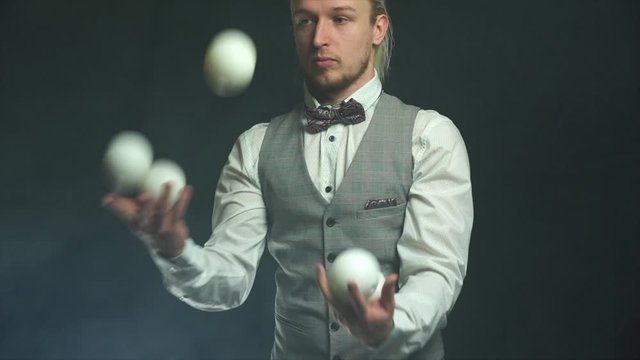 Closeup of man juggling balls. Concept of success, business and managing