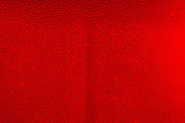 Water drops on red background,Detail of glass with red drink, cold, drops, background ,Red macro drink,Red bubbles abstract ,Beverage, macro, red