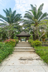 Fototapeta premium Walkway to gazebo at green garden