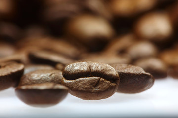 Fototapeta premium Roasted coffee beans on a table