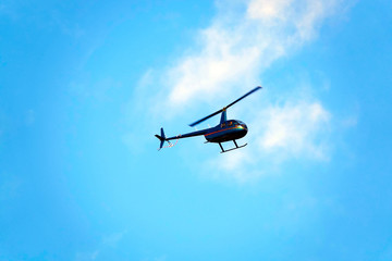 Helicopter in the blue sky