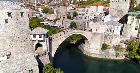 Mostar and old bridge from the air, Aerial view, Zoom in. - Powered by Adobe