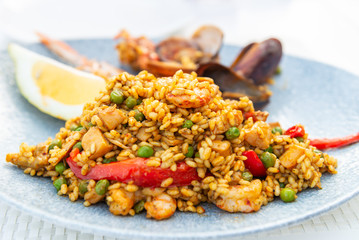 Portion of very tasty seafood paella in the plate