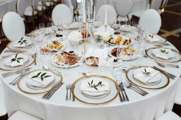 Magnificent table setting for celebrating weddings and other banquets. Wedding decor