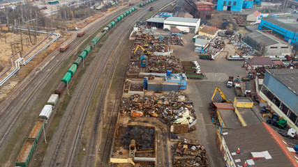 Sorting and recycling of metal waste top view. Scrap metal procurement station. Loading operations for the utilization of ferrous metals by air shooting.