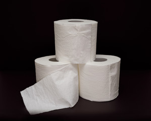 Toilet paper roll on black background