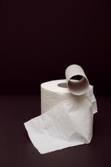 Toilet paper roll on black background