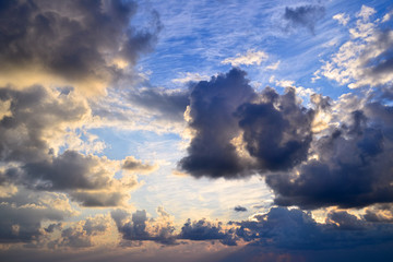 Bright colorful cloudy sky at sunset. Copy space for background