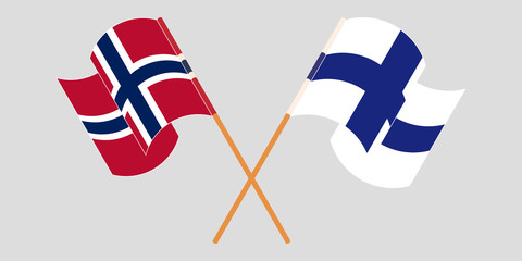 Crossed and waving flags of Norway and Finland