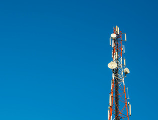Communication tower on blue sky background