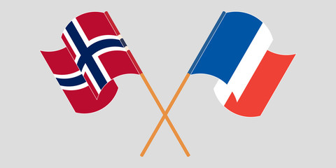 Crossed and waving flags of Norway and France