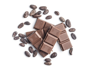 Milk chocolate bars and cocoa beans