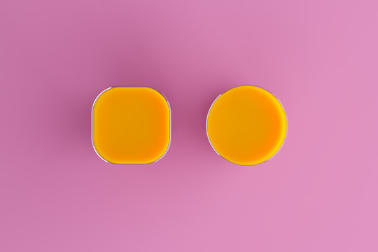 Orange juice in a glass with highlights on a purple background in the studio, place for text, icon, wallpaper