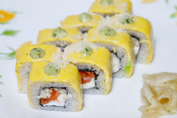 Sushi and rolls home delivery. Krpny plan. Sesame, salmon, cheese.