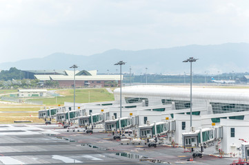 Fototapeta na wymiar PUTRAJAYA, MALAYSIA - DECEMBER 10, 2014 : Airplane dock at KLIA2 airport . Kuala Lumpur International Airport was opened on May 2014 and 2nd international airport in Malaysia.
