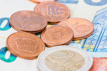 eur coin some cents on euro bank notes.