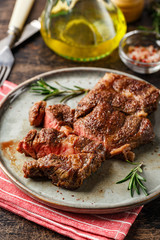 Two beef steak on dark gray background