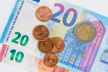 eur coin some cents on euro bank notes.