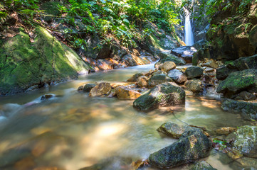 Naklejka na ściany i meble Waterfall at deep of tropical forest