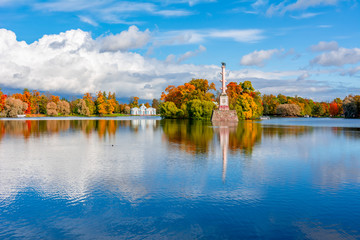 Grand pond with Grotto pavilion and Chesme column in autumn foliage in Catherine park, Pushkin,...