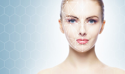 Face of a beautifyl girl with a scanning grid on her face. Face id, security, facial recognition, authentication technology.