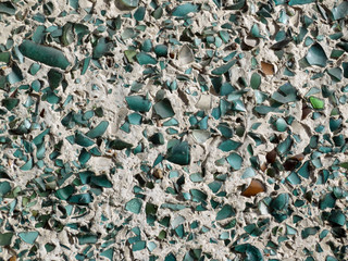 Decorative plaster walls with blue glass shards.