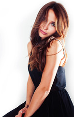Fototapeta premium young brunette pretty woman in black dress posing on white background emotional sensual, lifestyle people concept