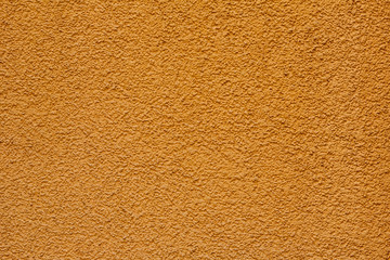 Bright yellow decorative stucco texture