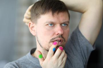 Man touches hands with germs coronavirus mouth. Avoid crowds. Limit contacts at close range....