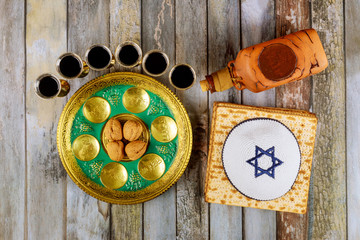 Jewish Passover matzah, kiddush and seder with text in hebrew egg, bone, herbs, karpas, chazeret and charoset